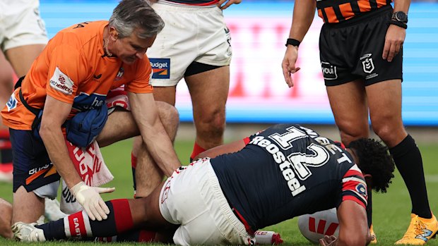 Siua Wong is injured in the first half.