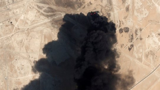 A satellite image from Planet Labs shows thick black smoke rising from Saudi Aramco's Abqaiq oil processing facility in Buqyaq, Saudi Arabia. 