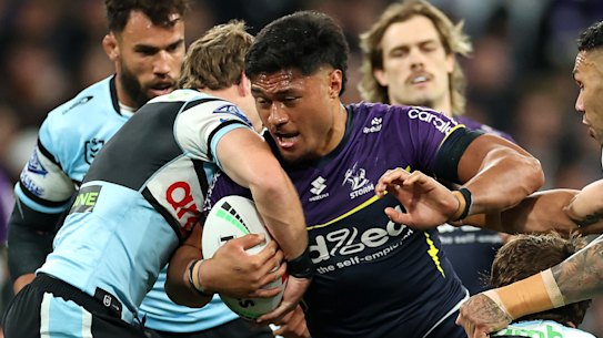 Stefano Utoikamanu charges into the Cronulla defence on Friday night.