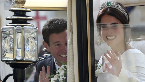 Britain's Princess Eugenie of York and her husband Jack Brooksbank in the Scottish State Coach after their wedding.