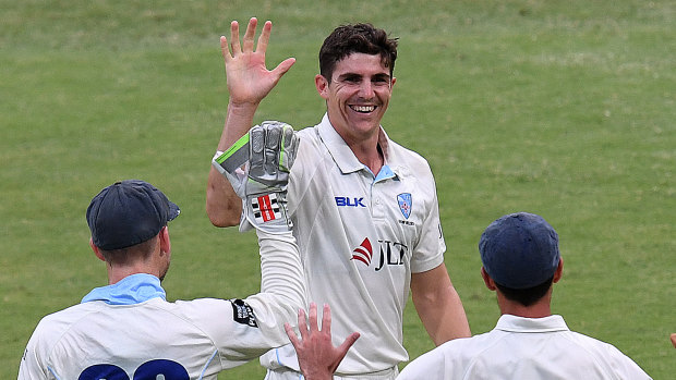 Spearhead: Sean Abbott celebrates after taking his fifth wicket against Queensland at the Gabba.
