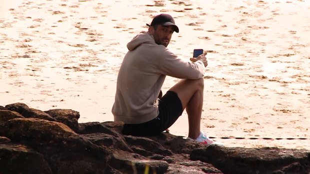 Paul Vaughan at the beach on Tuesday after being sacked by the Dragons for hosting a house party on Saturday.