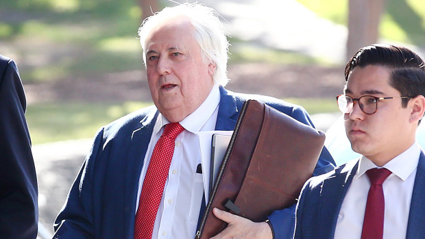 Businessman Clive Palmer arrives at the District Court in Brisbane on Thursday.