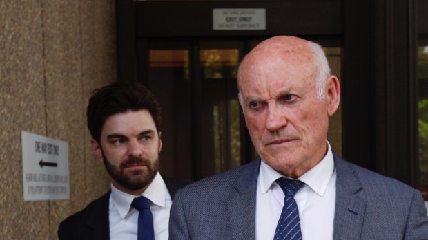 Ian Macdonald, right, arrives at court on Monday with his barrister Jonathan Martin.
Macdonald is facing a five-month long trial for misconduct in public office over a mining deal.