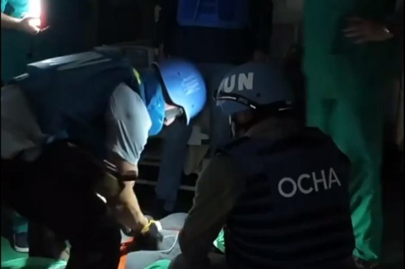 Dr Athanasios Gargavanis, trauma doctor, and other WHO staff evacuate patients from Nasser Hospital, Gaza. 