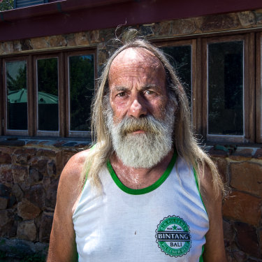 Rob Hallett 10 years on. He has rebuilt his home using the burnt stonework.