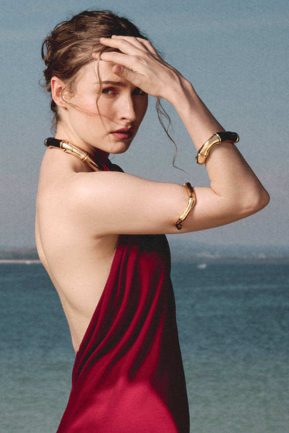 Dress and jewellery by Gucci.