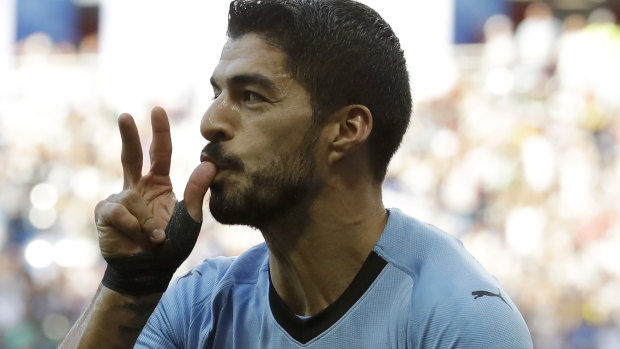 Moving on: Luis Suarez and Uruguay are into the last 16.