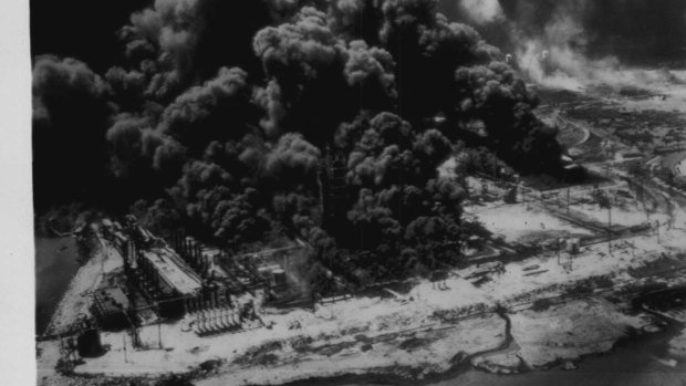 "An aerial view of burning industrial plants after an explosion aboard a French vessel in the harbor here today. April 1947."