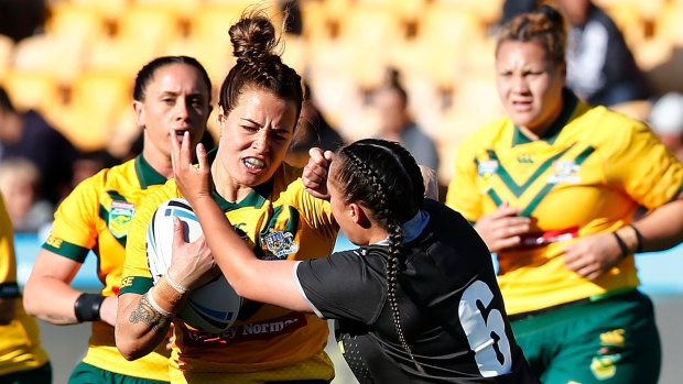 Jillaroo Isabelle Kelly, tackled by New Zealand's Raecene McGregor earlier this year, claimed the women's award.