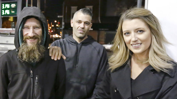 Johnny Bobbitt, left, Kate McClure, and McClure's boyfriend Mark D'Amico in Philadelphia last November. 