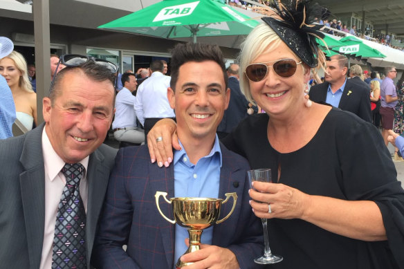 Dean Holland, centre, celebrates winning the 2019 Adelaide Cup on Surprise Baby with father Darren and mother Belinda.