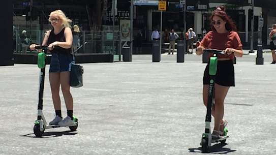 Lime scooter riders risk brain injury and death while zipping around without helmets on in Brisbane city.