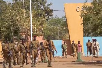 In this image made from video, Burkina Faso mutinous soldiers seize military barracks in the capital. 