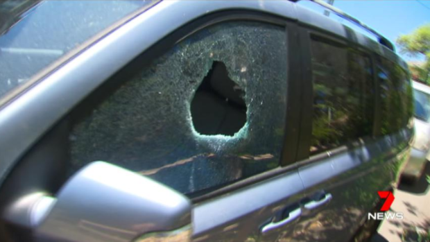 A smashed window after police had to rescue a toddler from a hot car last year in Sydney.