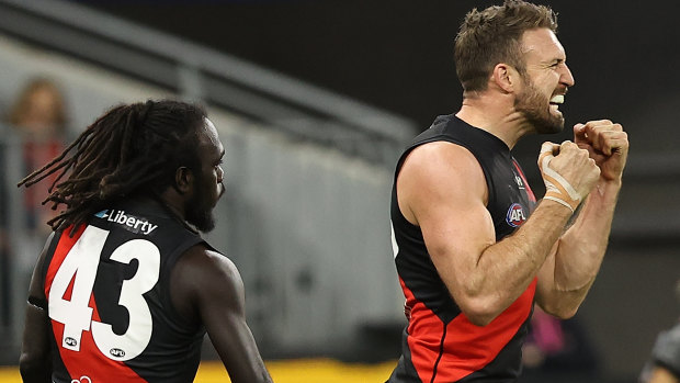 Cale Hooker celebrates a key goal against the Eagles at Optus Stadium.