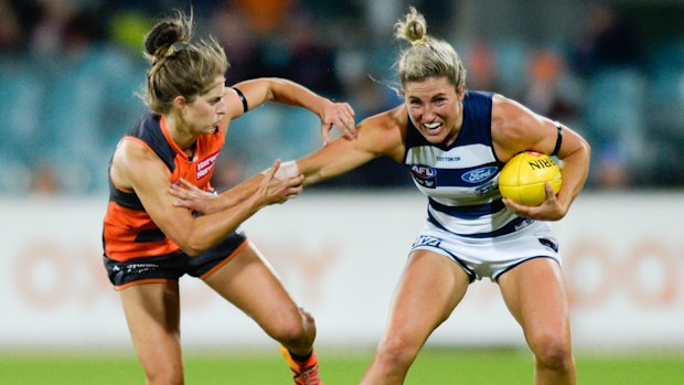 Brush off: Greater Western Sydney's Ellie Brush pressures Melissa Hickey of the Cats during the Giants' round 7 win over Geelong on Friday night.