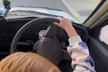 A video has been posted online of a three-year-old behind the wheel of a white ute, steering through Perth’s suburban streets.