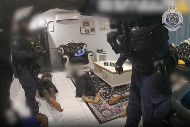 Four people are placed under arrest during a search warant.