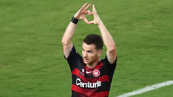 Former Wanderers midfielder Alex Baumjohann says the club "gave up" midway through last season.