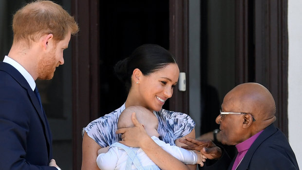 Prince Harry, Meghan, Duchess of Sussex, and their son, Archie, with 
 Archbishop Desmond Tutu in Cape Town, South Africa, last September.