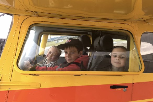 Jett and his sisters in a light plane.
