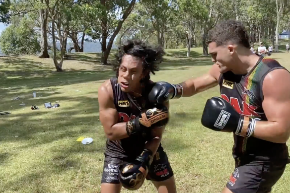 Nathan Cleary punches Penrith teammate Jarome Luai.