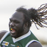 Anthony McDonald-Tipungwuti jumps for joy in Imperials’ premiership win in the Sunraysia Football League.