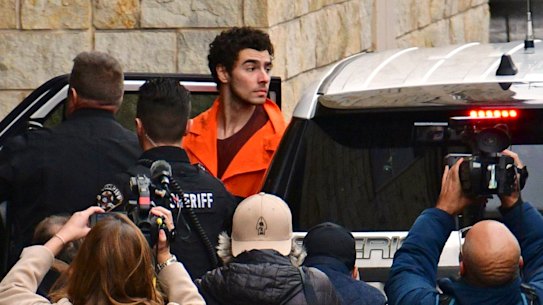 Suspect Luigi Mangione is taken into the Blair County Courthouse.