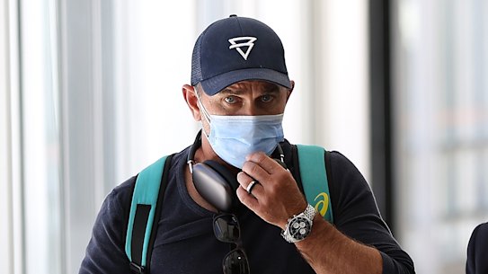 Justin Langer arrives at Perth Airport on Saturday after resigning as head coach of the Australian men’s team.