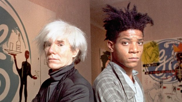 Andy Warhol (left) with Jean-Michel Basquiat in 1985.