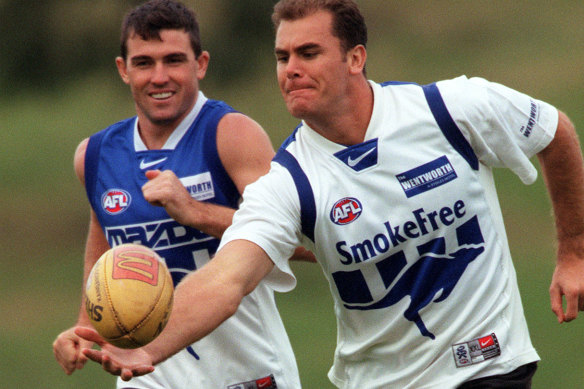 Anthony Stevens and Wayne Carey during their playing days at North Melbourne.