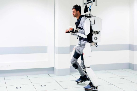 Thibault was able to walk nine metres in the AI-powered exoskeleton.