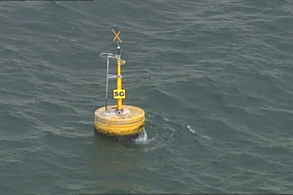 Aerial footage of the buoy in Port Phillip Bay where the sailor was found.