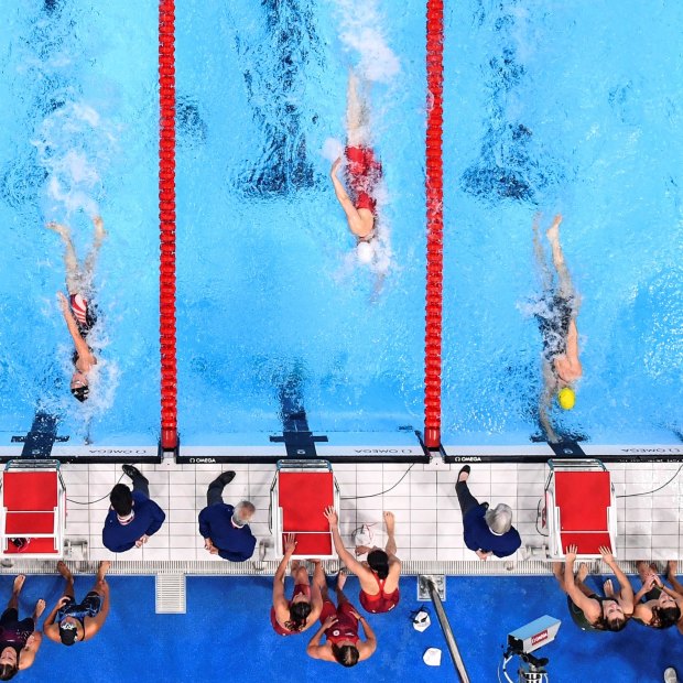 Cate Campbell touches the wall just before Abbey Weitzeil in the women’s 4x100m medley relay.