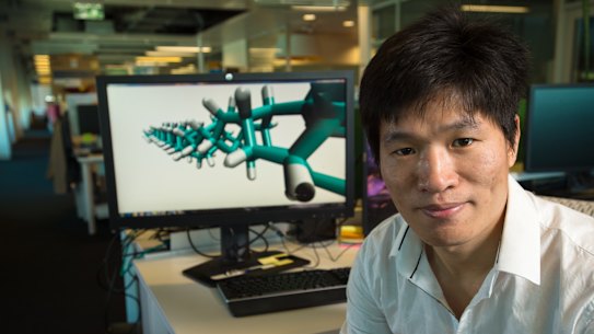 QUT's Dr Haifei Zhan with a molecular model of the diamond nanothread 