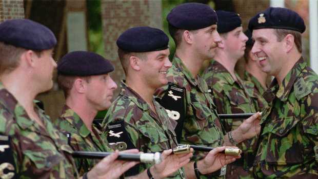 Prince Andrew, right, talks with members of the 1st Battalion the Staffordshire Regiment, stationed in Hong Kong with the British military forces. in 1996.