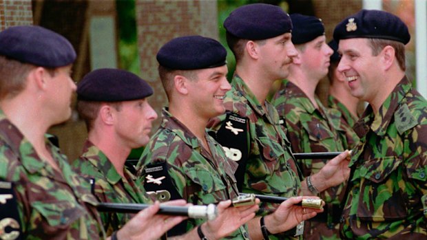 Prince Andrew, right, talks with members of the 1st Battalion the Staffordshire Regiment, stationed in Hong Kong with the British military forces. in 1996.