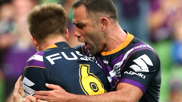 Cameron Smith celebrates with Cameron Munster after the playmaker broke the deadlock for the Storm. 