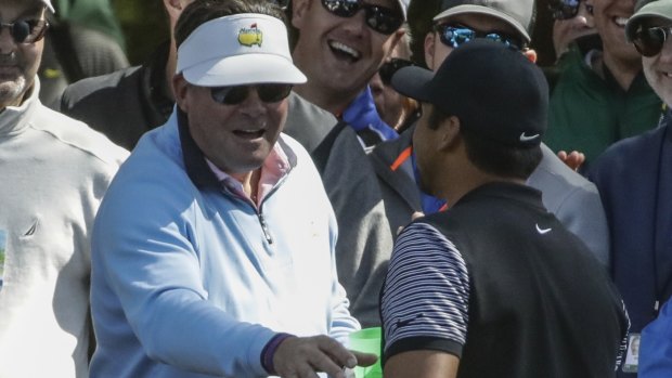 Driven to drink: Jason Day collects his ball out of a fan's beer cup.