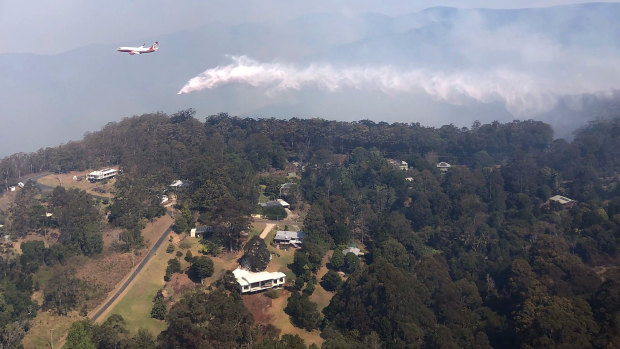 QFES Large Air Tanker dropping 15,000 litres of water over bushfires in Binna Burra in the Scenic Rim region.