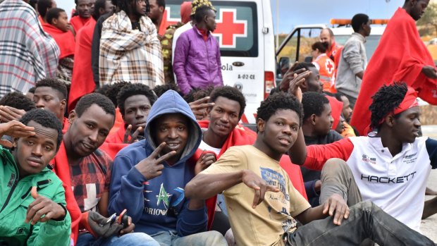 Migrants from Africa stormed a border fence to enter Spain's North African enclave of Ceuta from Morocco in December.