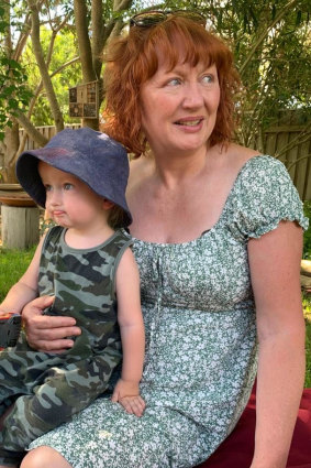 Sue Given, an ex-Mormon, with her grandson. Given quit the Church over its homophobia.