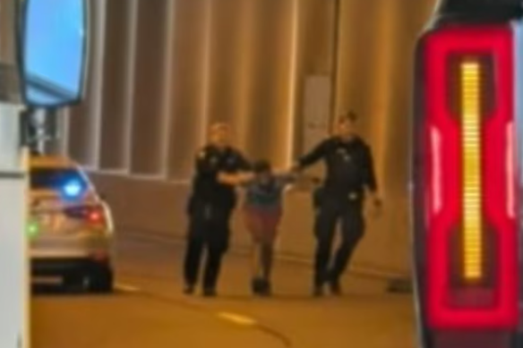 A man in his 20s was taken into custody near the Clem Jones Tunnel entrance on Tuesday.