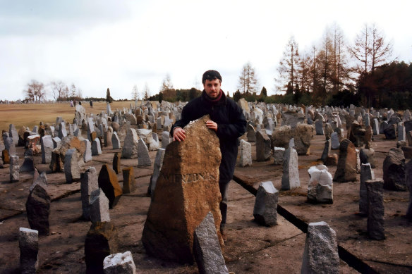 Mark Baker at Treblinka death camp, on a research trip for The Fiftieth Gate in front of a stone that has written on it Wierzbnik, the town where his father Yossl was born, 1995. 