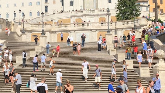 Tourists flock to the Spanish Steps in Rome.