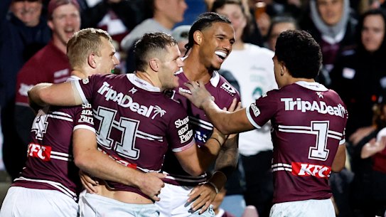 The Sea Eagles celebrate a Jason Saab try.