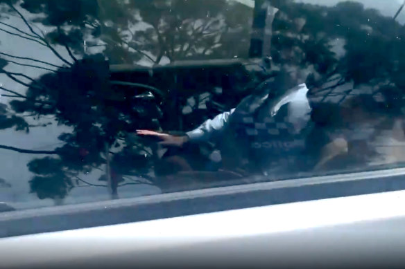 Amrick Roy in a police car after his arrest on Thursday.