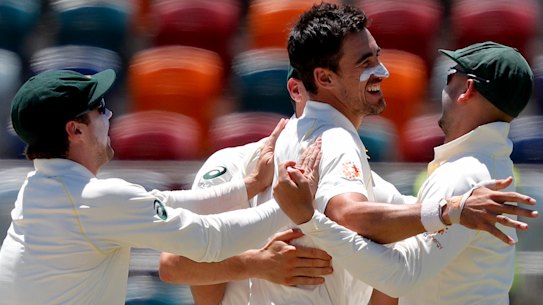 Australia's Mitchell Starc (centre) celebrates.