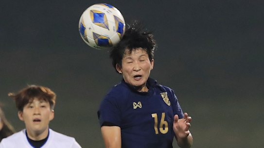 Khwanrudi Saenngoen of Thailand heads the ball during the Women's Olympic Football Tournament.